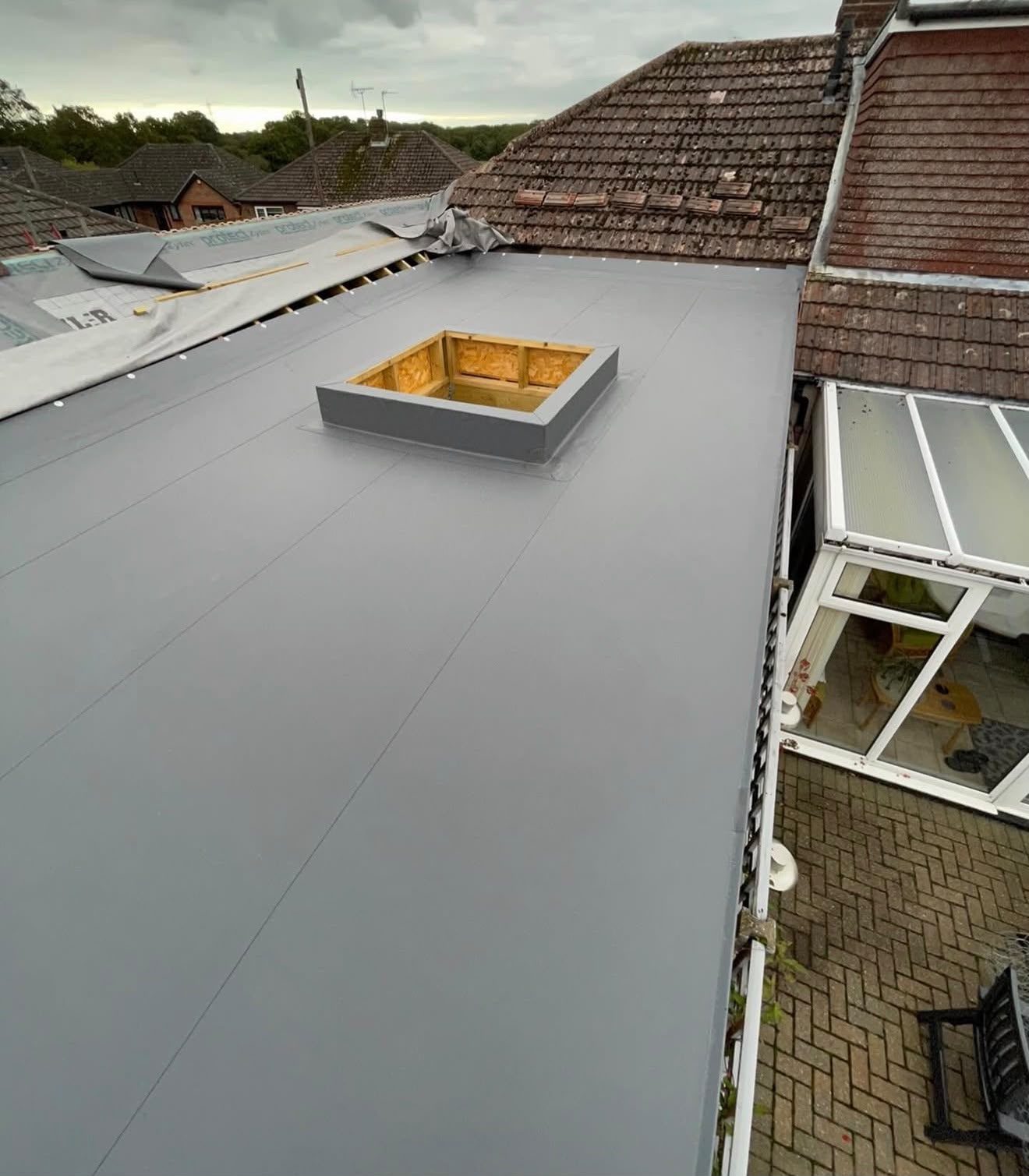 Rooflight kerb formed and weathered into a single-ply flat roof by Platinum Flat Roofing, project photograph 5