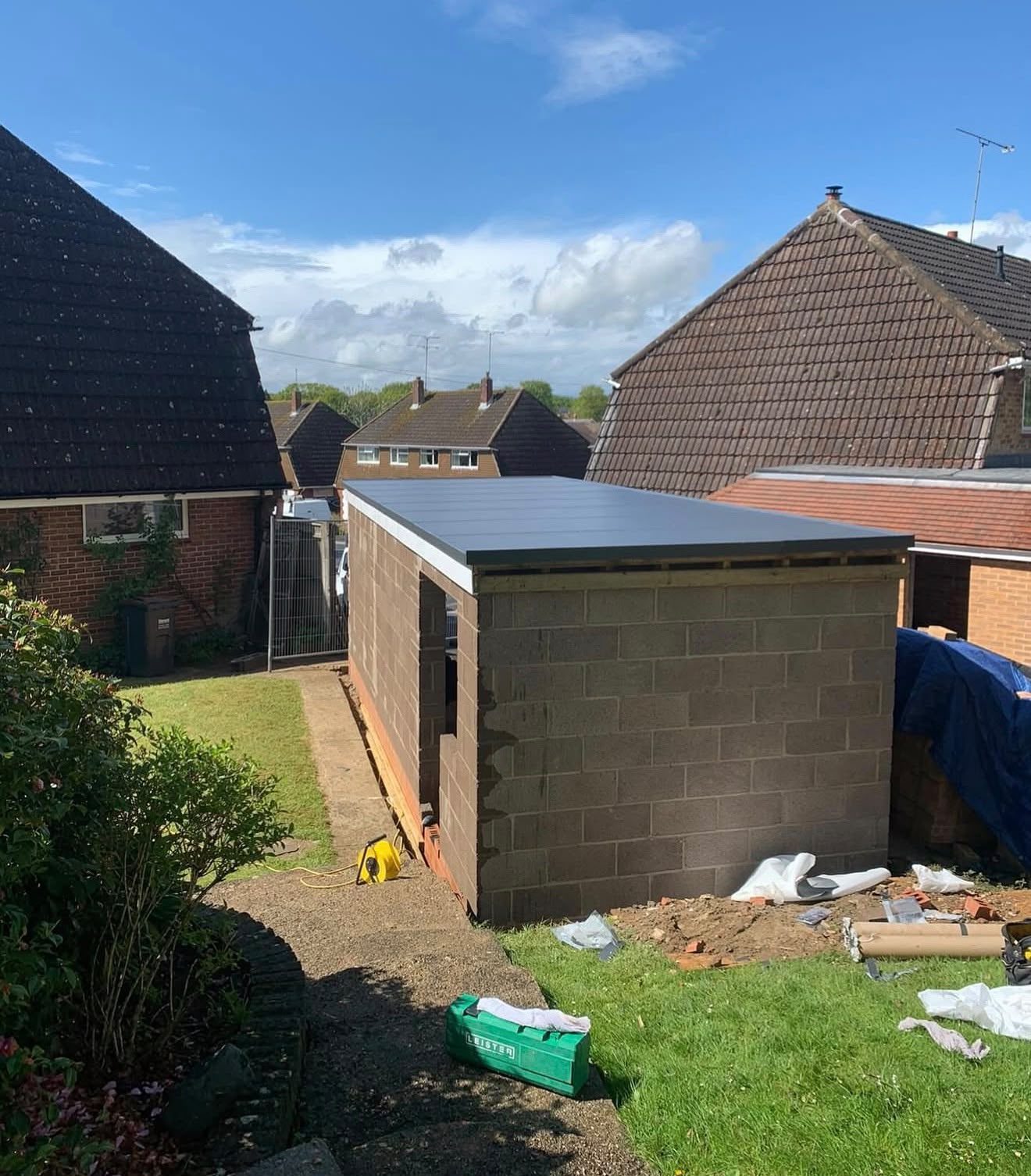 New build garden room with a finished grey flat roof in Bromley