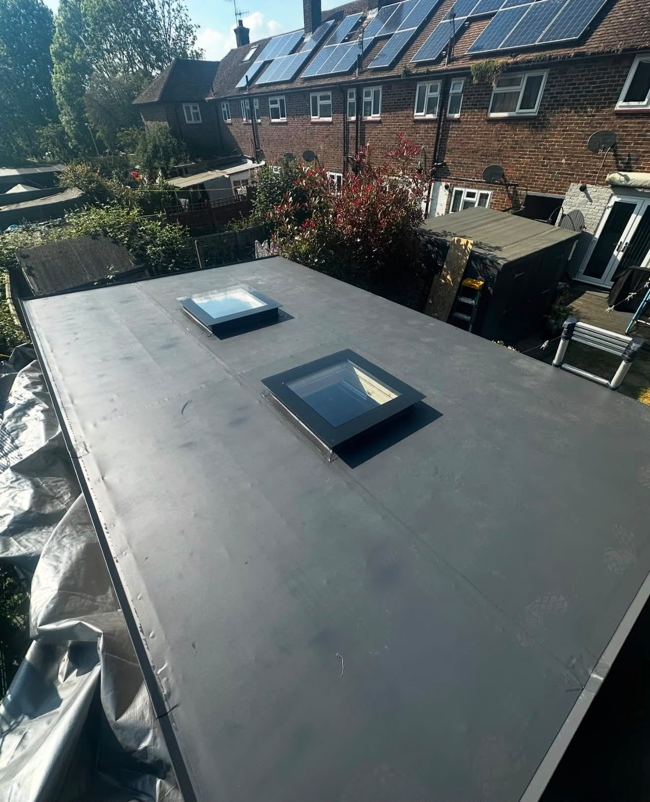 Rooflight kerb formed and weathered into a single-ply flat roof by Platinum Flat Roofing, project photograph 8