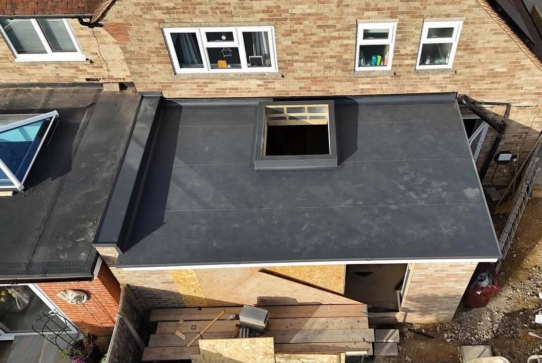 Flat roof with rooflight opening formed and weathered in London